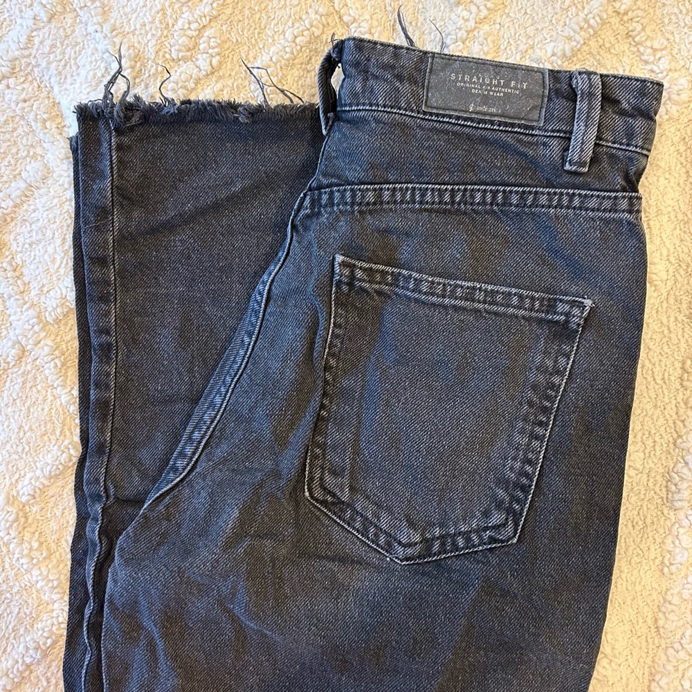 high wasted flared, tight fitting black denim jeans